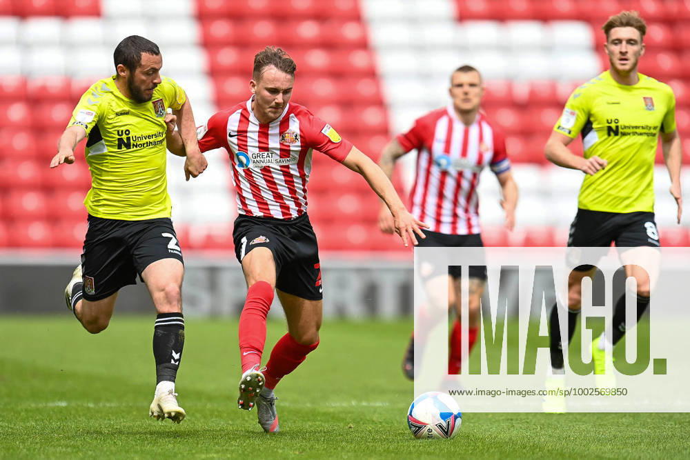 Sunderland v Northampton Town EFL Sky Bet League 1 09 05 2021. Michael Harriman ( 2) of Northampton Town FC pulls back Jack Diamond ( 21) of Sunderland AFC during the EFL Sky Bet League 1 match between Sunderland AFC and Northampton Town at the Stadium Of Light, Sunderland, England on 9 May 2021. Editorial use only DataCo restrictions apply See www.football-dataco.com ,