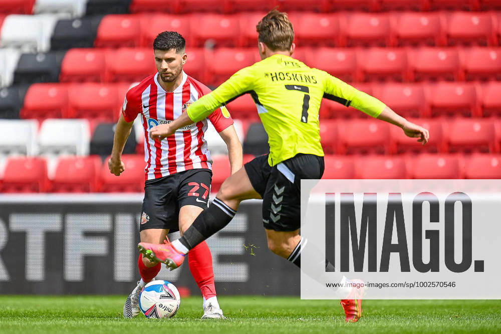 Sunderland v Northampton Town EFL Sky Bet League 1 09 05 2021. Jordan Jones ( 27) of Sunderland AFC looks to run at Sam Hoskins ( 7) of Northampton Town FC during the EFL Sky Bet League 1 match between Sunderland AFC and Northampton Town at the Stadium Of Light, Sunderland, England on 9 May 2021. Editorial use only DataCo restrictions apply See www.football-dataco.com ,