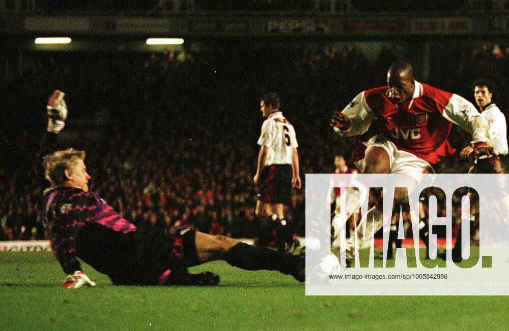 Mandatory Credit: Photo by Andy Hooper Daily Mail Shutterstock (1140729a) Ian Wright Dives In With Both Feet On Peter Schmeichel Arsenal V Manchester United, ManU Football Premier League Premiership Ian Wright Dives In With Both Feet On Peter Schmeichel Arsenal V Manchester United Football Premier League Premiership No use with unauthorised audio, video, data, fixture lists (outside the EU), club league logos or live services. Online in-match use limited to 45 images (+15 in extra time). No use to emulate moving images. No use in betting, games or single club league player publications services. Ian Wright Dives In With Both Feet On Peter Schmeichel Arsenal V Manchester United Football Premier League Premiership No use with unauthorised audio, video, data, fixture lists (outside the EU), club league logos or live services. Online in-match use limited to 45 images (+15 in extra time). No use to emulate moving images. No use in betting, games or