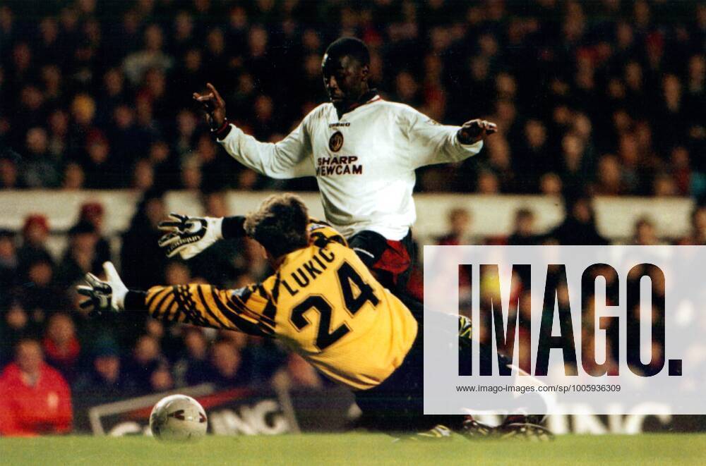 Mandatory Credit: Photo by Andy Hooper ANL Shutterstock (1334834a) Football 1996 97: Premier League - Arsenal 1 V Manchester United, ManU 2. Man Utd s Andy Cole Rounds Keeper John Lukic. Football 1996 97: Premier League - Arsenal 1 V Manchester United 2. Man Utd s Andy Cole Rounds Keeper John Lukic. No use with unauthorised audio, video, data, fixture lists (outside the EU), club league logos or live services. Online in-match use limited to 45 images (+15 in extra time). No use to emulate moving images. No use in betting, games or single club league player publications services. Football 1996 97: Premier League - Arsenal 1 V Manchester United 2. Man Utd s Andy Cole Rounds Keeper John Lukic. No use with unauthorised audio, video, data, fixture lists (outside the EU), club league logos or live services. Online in-match use limited to 45 images (+15 in extra time). No use to emulate moving images. No use in betting, games or