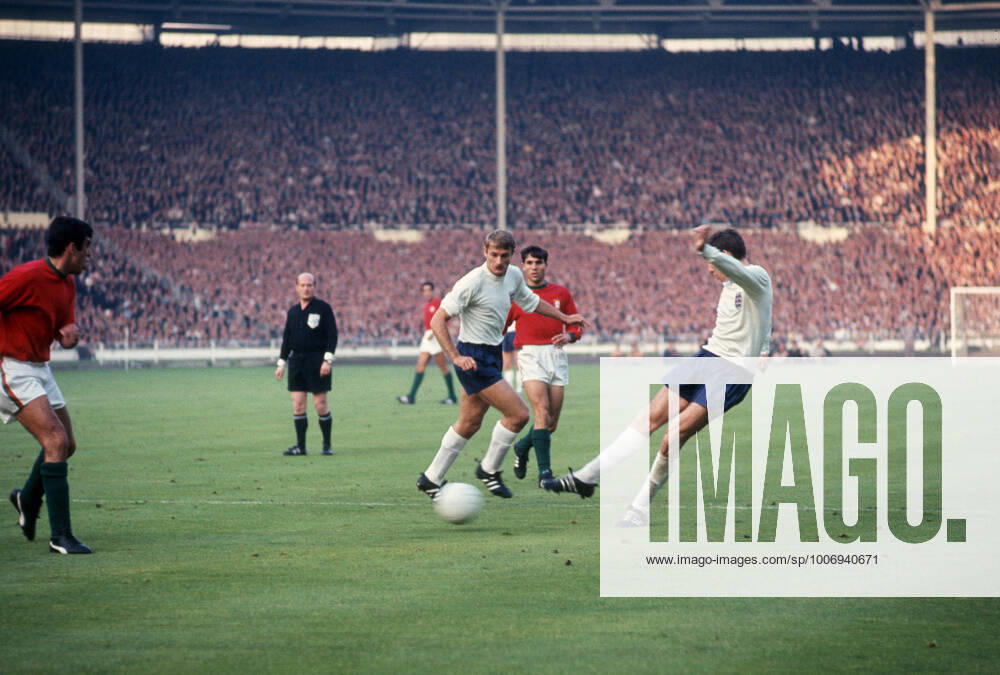 England v Portugal 26 July 1966, London - Football World Cup 1966 - England v Portugal - Roger Hunt of England watches Martin Peters pass the ball - Photo: Gerry Cranham Offside. London UK
