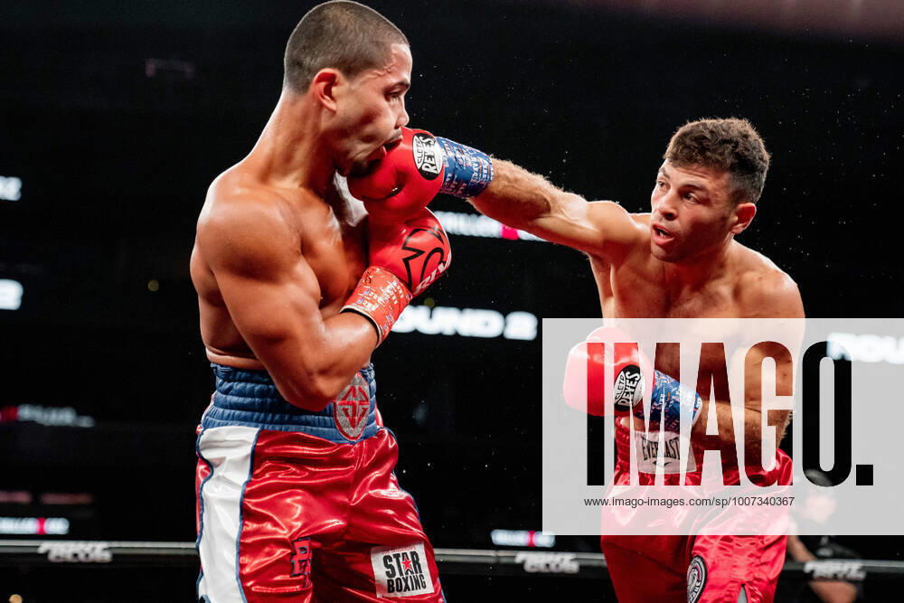 Daniel Gonzalez (red and blue shorts with white stripes) and Petros Ananyan battle in a vacant WBA Continental Americas Super Lightweight Championship bout at the Barclays Center in Brooklyn, New York. Petros Ananyan won by decision. Brooklyn USA - ZUMAp109 20211016_zaf_p109_013