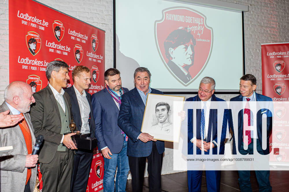 Cyclist Eddy Merckx (3R) is seen at a ceremony for the Raymond Goethals Award for the coach whose style was the closest to the style of Goethals, Monday 20 December 2021, in Grimbergen. JONASxROOSENS x3160486x