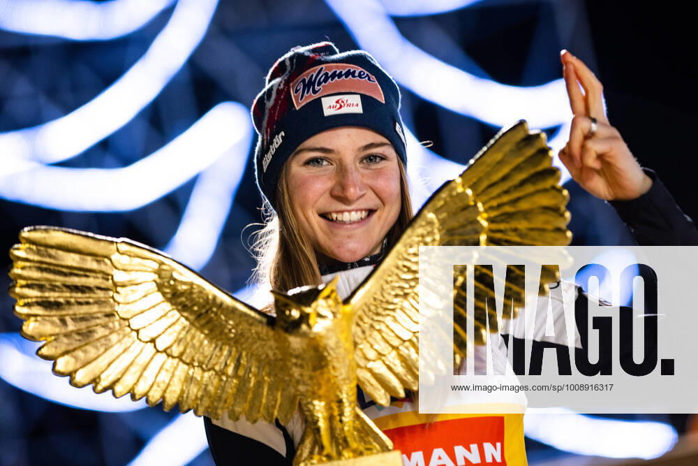 KW52 Ski jumping, Skispringen, Ski, nordisch - FIS WC Ljubno LJUBNO,SLOVENIA,01.JAN.22 - NORDIC SKIING, SKI JUMPING - FIS World Cup, normal hill, ladies. Image shows the rejoicing of Marita Kramer (AUT). Keywords: trophy. GEPAxpictures Klansek