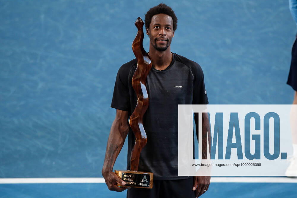 KW01 TENNIS ADELAIDE INTERNATIONAL, Gael Monfils of France celebrates victory with his trophy after his match with Karen Khachanov of Russia in the Final of the the Adelaide International Tennis Tournament, at Memorial Drive, in Adelaide, Sunday, January 9, 2022. ( NO ARCHIVING, , NO USE IN BOOKS WITHOUT CONSENT ADELAIDE SA AUSTRALIA