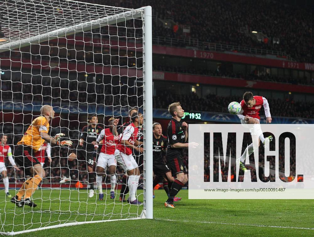 Arsenals Laurent Koscielny scoring his sides opening goal Arsenal v AC Milan, UEFA Champions League, Knockout round, Second Leg at the Emirates, London. 6th March 2012 .