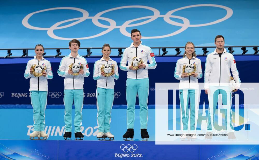 China Olympics 2022 Figure skating, Eiskunstlauf Team Event 8106629 07.02.2022 Gold medalists Russian Olympic Committee s Kamila Valieva, Mark Kondratiuk, Anastasia Mishina, Aleksandr Galliamov, Victoria Sinitsina and Nikita Katsalapov celebrate on the poduim during the flower ceremony for the figure skating team event during the Beijing 2022 Winter Olympic Games, Olympische Spiele, Olympia, OS at Capital Indoor Stadium in Beijing, China. Grigory Sysoev Sputnik Beijing China