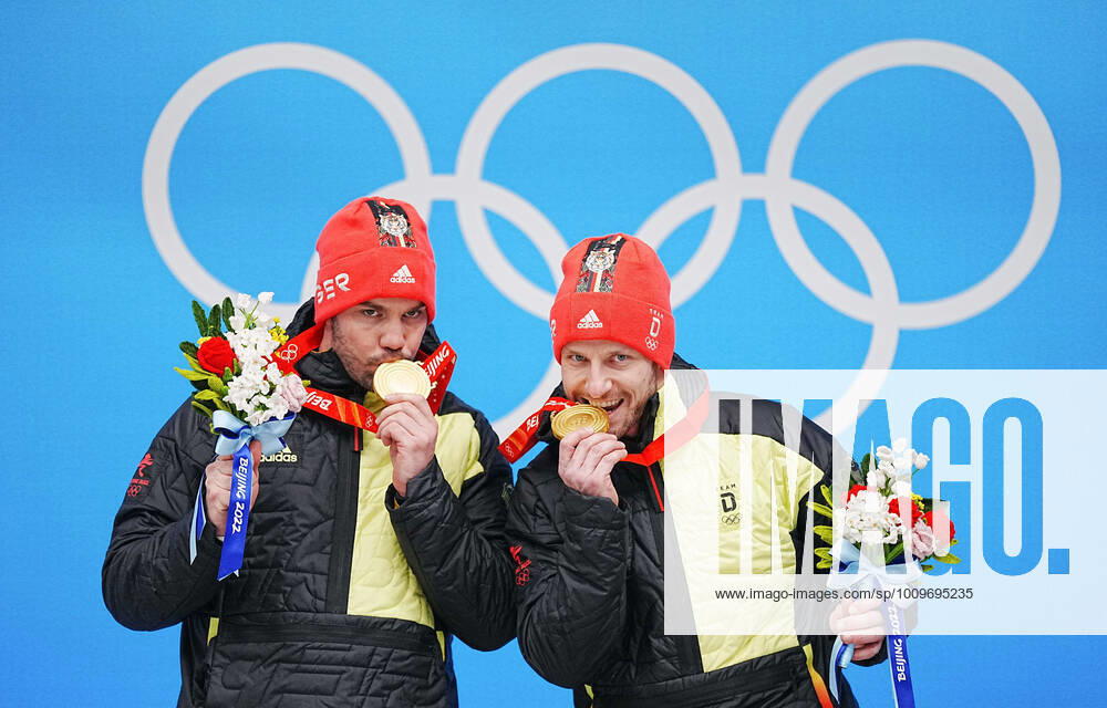 (220209) -- BEIJING, Feb. 9, 2022 -- Gold medalists Tobias Wendl Tobias Arlt of Germany celebrate during the awarding ceremony of luge doubles run at the Yanqing National Sliding Centre in Yanqing district of Beijing, capital of China, Feb. 9, 2022. ) (BEIJING2022)CHINA-BEIJING-YANQING-OLYMPIC Winter games, Winterspiele,Spiele, Summer games LUGE-DOUBLES (CN) JiangxWenyao
