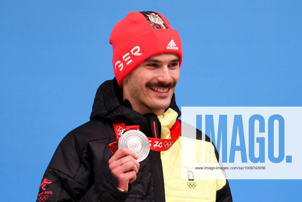 Silver medalist, Axel Jungk of Germany poses for a photograph during an award ceremony for the men s skeleton event at the 2022 Winter Olympics at the Yanqing National Sliding Centre. Anton Novoderezhkin TASS TS1228A2