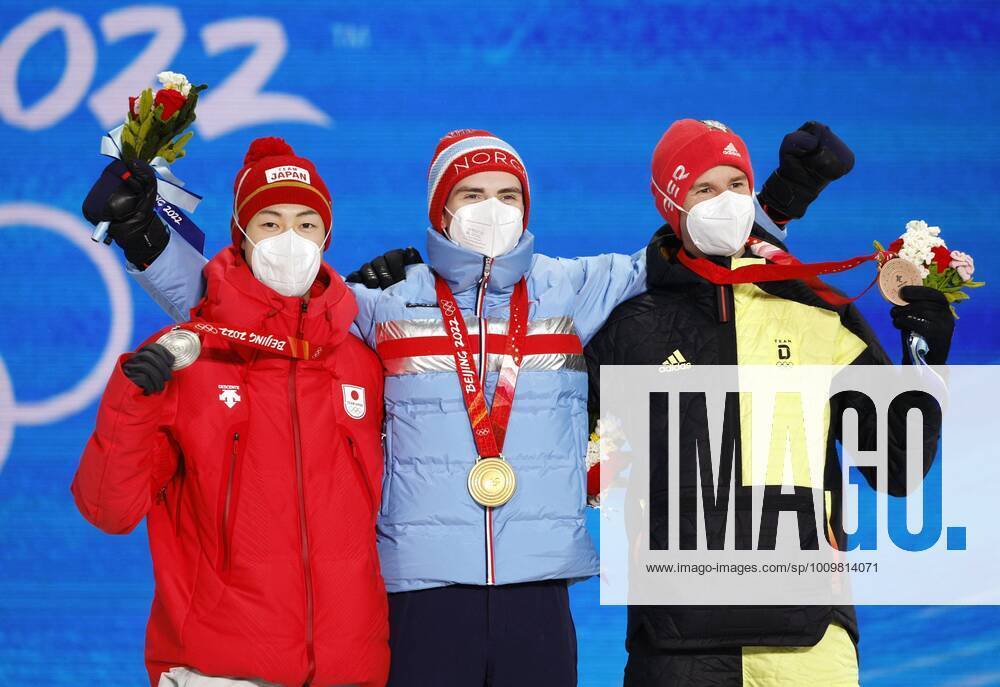 Beijing Olympics: Ski jumping, Skispringen, Ski, nordisch (From L) silver medalist Ryoyu Kobayashi of Japan, gold medalist Marius Lindvik of Norway and bronze medalist Karl Geiger of Germany pose for a photo during the medal ceremony for the men s large hill individual ski jumping at the Beijing Winter Olympics on Feb. 13, 2022, in Zhangjiakou, China. A14AA0001238447P