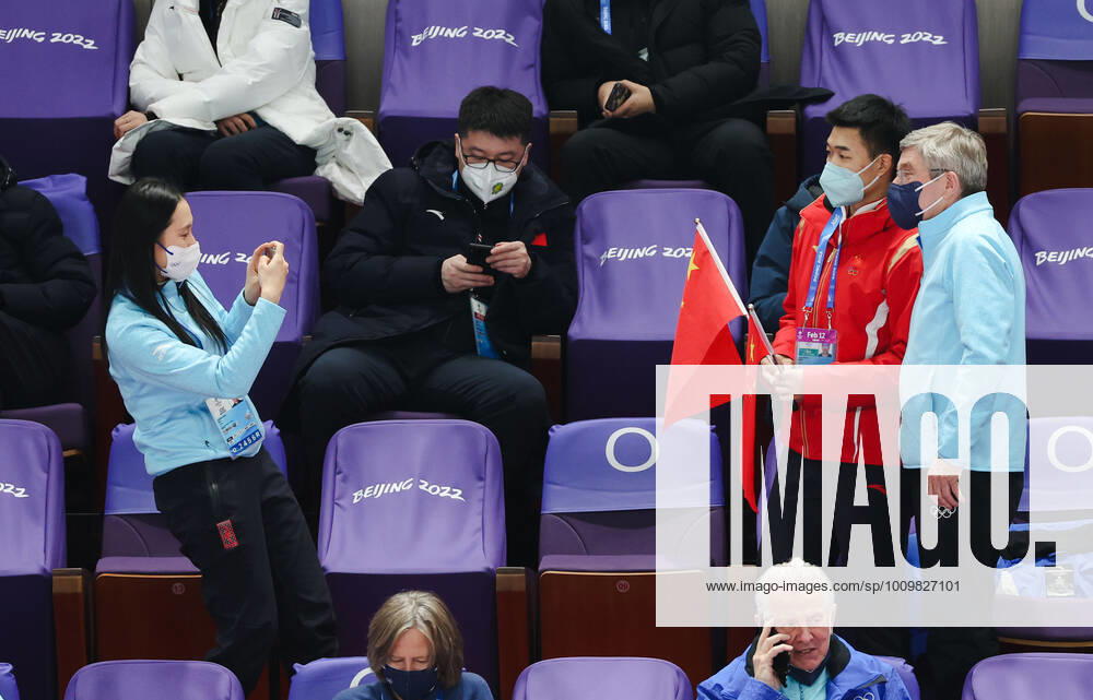 (220213) -- BEIJING, Feb. 13, 2022 -- International Olympic Committee (IOC) member Zhang Hong (L) takes a photo for IOC president Thomas Bach (R) and China s gold medalist Gao Tingyu during short track Speed skating, Eisschnelllauf events at Capital Indoor Stadium in Beijing, capital of China, Feb. 13, 2022. ) (BEIJING2022)CHINA-BEIJING-OLYMPIC Winter games, Winterspiele,Spiele, Summer games SHORT TRACK SPEED SKATING-IOC-BACH (CN) CaoxCan