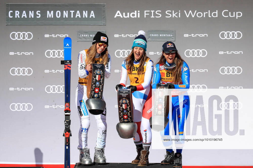 KW08 ALPINE SKIING - FIS WC Crans Montana CRANS MONTANA,SWITZERLAND,27.FEB.22 - ALPINE SKIING - FIS World Cup, downhill, ladies. Image shows the rejoicing of Ester Ledecka (CZE), Priska Nufer (SUI) and Sofia Goggia (ITA). Keywords: trophy. GEPAxpictures Buehner