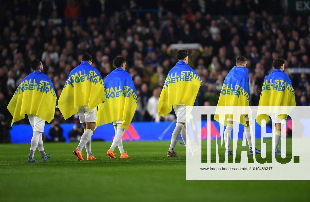 KW10 Mandatory Credit: Photo by Anna Gowthorpe Shutterstock (12843054s) Leeds United walk onto the pitch wearing football stands together flags supporting Ukraine Leeds United v Aston Villa, Premier League, Football, Elland Road, Leeds, UK - 10 Mar 2022 Leeds United v Aston Villa, Premier League, Football, Elland Road, Leeds, UK - 10 Mar 2022