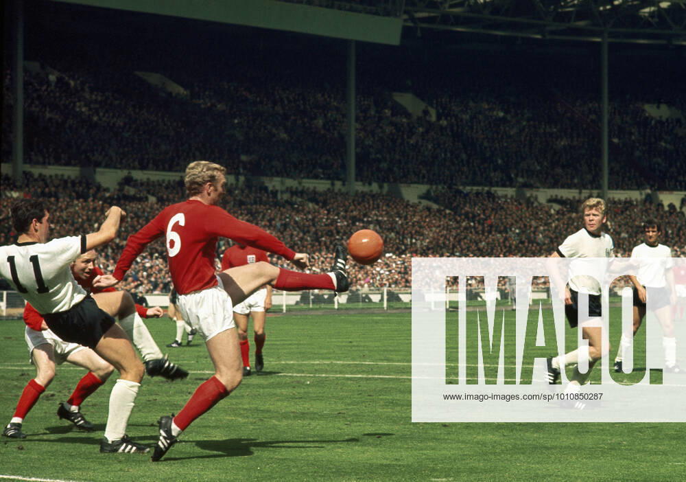 1966 World Cup Final 30 July 1966 - FIFA World Cup, WM, Weltmeisterschaft, Fussball Final - England v West Germany Bobby Moore sticks his foot out to clear the ball Photo: Gerry Cranham Offside London UK