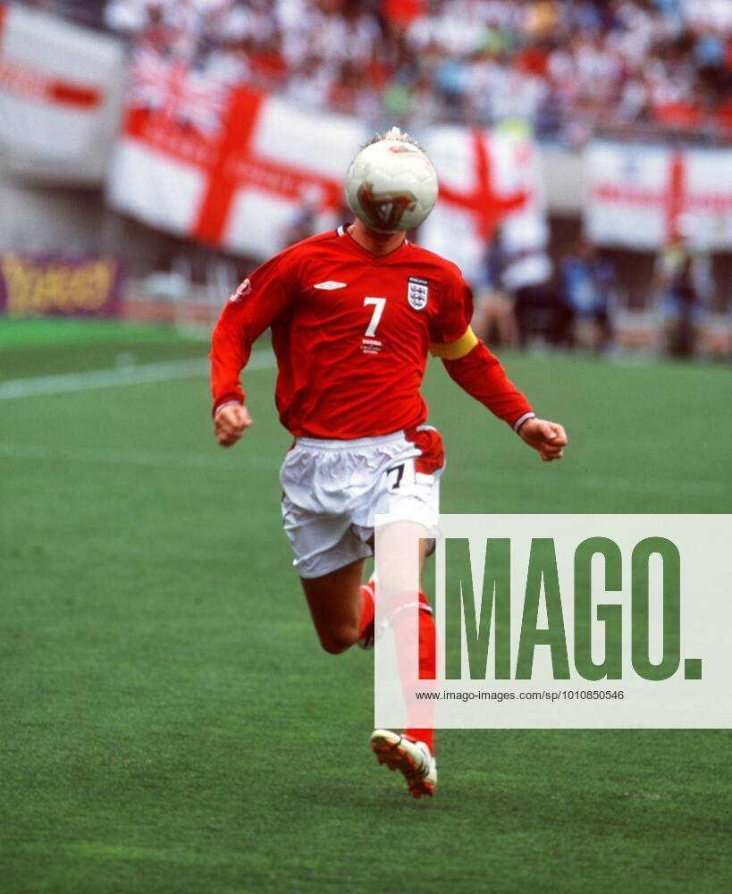 David Beckham 2002 12 6 2002 World Cup 2002 - England v Nigeria David Beckham runs along as the ball bounces up and covers his face. Photo: Mark Leech Ibaraki Japan