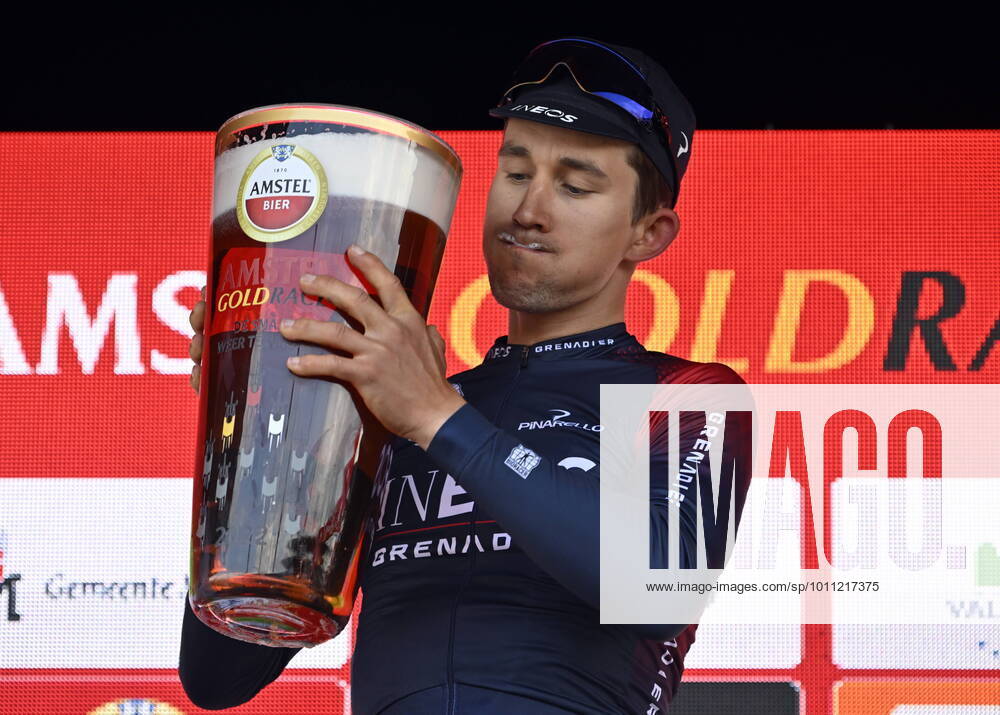 KW14 Polish Michal Kwiatkowski of Ineos Grenadiers drinks a gigantic glass of Amstel beer as he celebrates on the podium after winning the men elite Amstel Gold Race one day cycling race, 254,1 km from Maastricht to Valkenburg, The Netherlands, Sunday 10 April 2022. ERICxLALMAND x32909551x