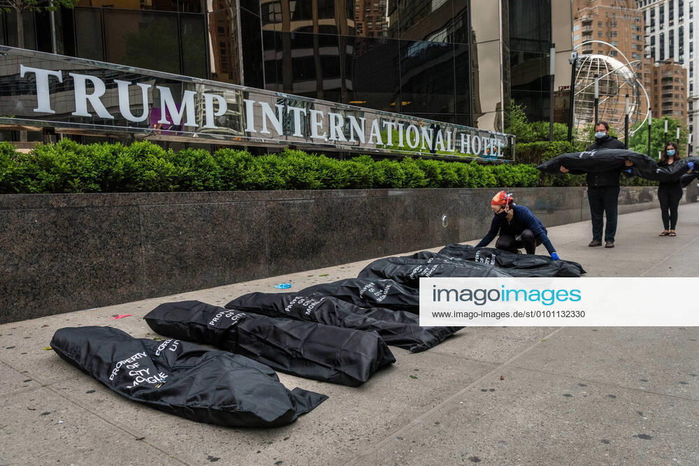 NYC: Activists place body bags outside Trump Hotel Activists from Rise and Resist and Indivisible Brooklyn place body bags outside Trump International Hotel and Tower in New York City, symbolizing the number of Americans who so far have died due to complications of the COVID-19 virus on May 24, 2020. New York New York United States