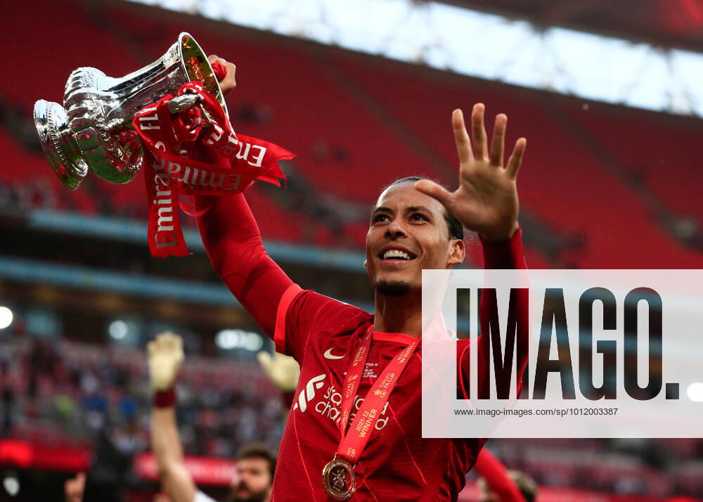 14th May 2022 ; Wembley Stadium, London England; FA Cup Final, Chelsea versus Liverpool: Virgil van Dijk of Liverpool lifts the FA Cup Trophy with his team mates after beating Chelsea on a penalty shootout ActionPlus12389724 JohnxPatrickxFletcher Content restricted for UK based newspaper