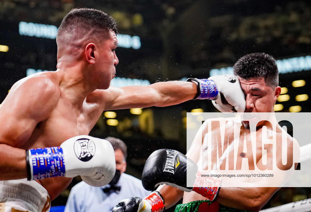 JESUS RAMOS (coral trunks) battles LUKE SANTAMARIA in a super welterweight bout at the Barclays Center in Brooklyn, New York. Ramos won by unanimous decision. Brooklyn USA - ZUMAp109 20220528_zaf_p109_009