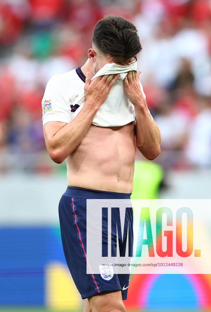 Budapest, Hungary, 4th June 2022. Declan Rice of England wipes his face during the UEFA Nations League match at Puskas Arena, Budapest. Picture credit should read: David Klein Sportimage . SPI-1726-0065