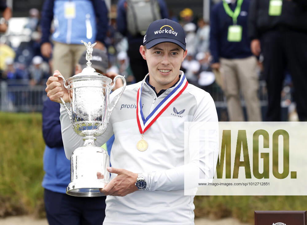 KW24 Matt Fitzpatrick of England holds the championship trophy on the 18th green after winning the 122nd United States Open Championship in the final round at The Country Club in Brookline, MA on Sunday, June 19, 2022. Fitzpatrick won his first major championship at the 2022 US Open with a score of 6 under par. BOP20220619157 JohnxAngelillo