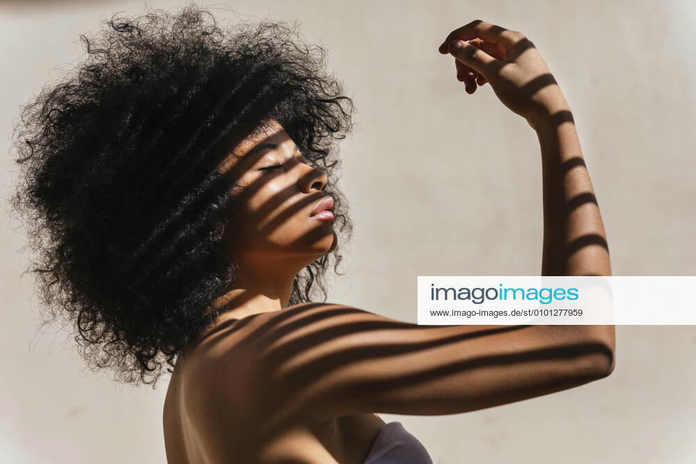 Portrait of young woman with shadow on her body model released Symbolfoto TCEF00629