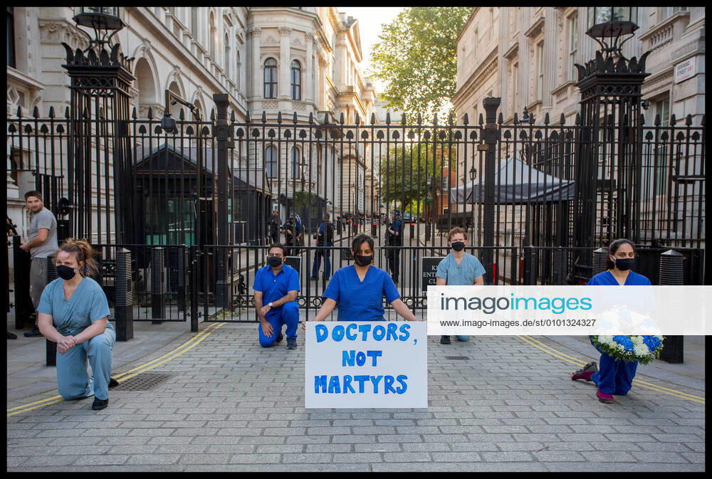 London, United Kingdom. Clap For Our Carers. NHS medics hold silent protest at gates of Downing Street while as Boris Johnson took part in Clap for Our Carers. xMartynxWheatleyx xi-Imagesx IIM-21185-0008