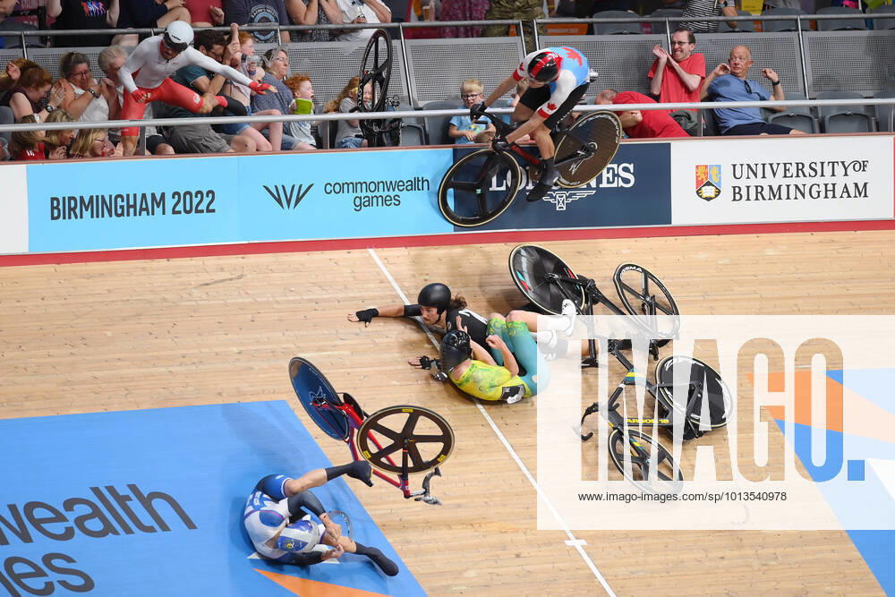 KW30 COM22 CYCLING QUALIFYING, Matt Walls of England (left) crashes over the rail during a crash with George Jackson of New Zealand and Joshua Duffy of Australia (centre) in the Men?s 15km Scratch Race on Day 3 of the XXII Commonwealth Games at the Lee Valley VeloPark in Birmingham, England, Sunday, July 31, 2022. ( NO ARCHIVING, , NO USE IN BOOKS WITHOUT CONSENT BIRMINGHAM UNITED KINGDOM