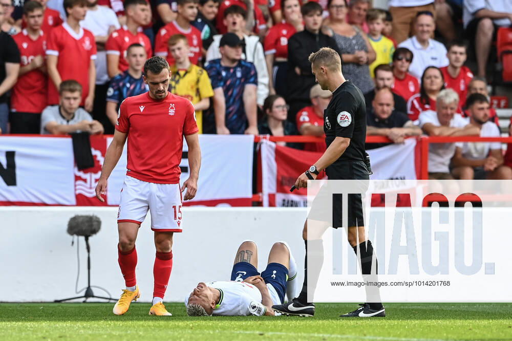 Premier League Nottingham Forest v Tottenham Hotspur Referee Craig Pawson speaks to Richarlison 9 of Tottenham Hotspur after he takes a knock in the groin Nottingham City Ground Nottinghamshire United Kingdom