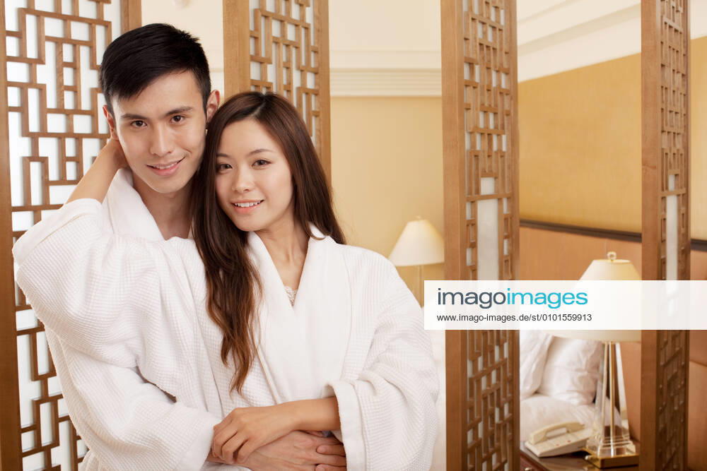 A couple enjoying life in a hotel room 55295075424536802