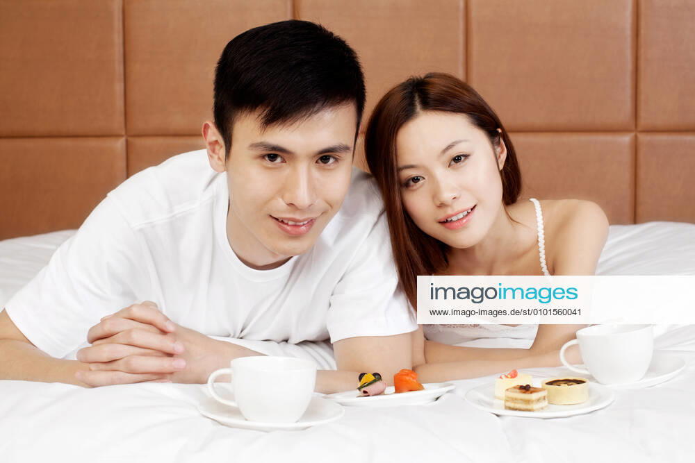 A couple enjoying life in a hotel room 55295075424538312