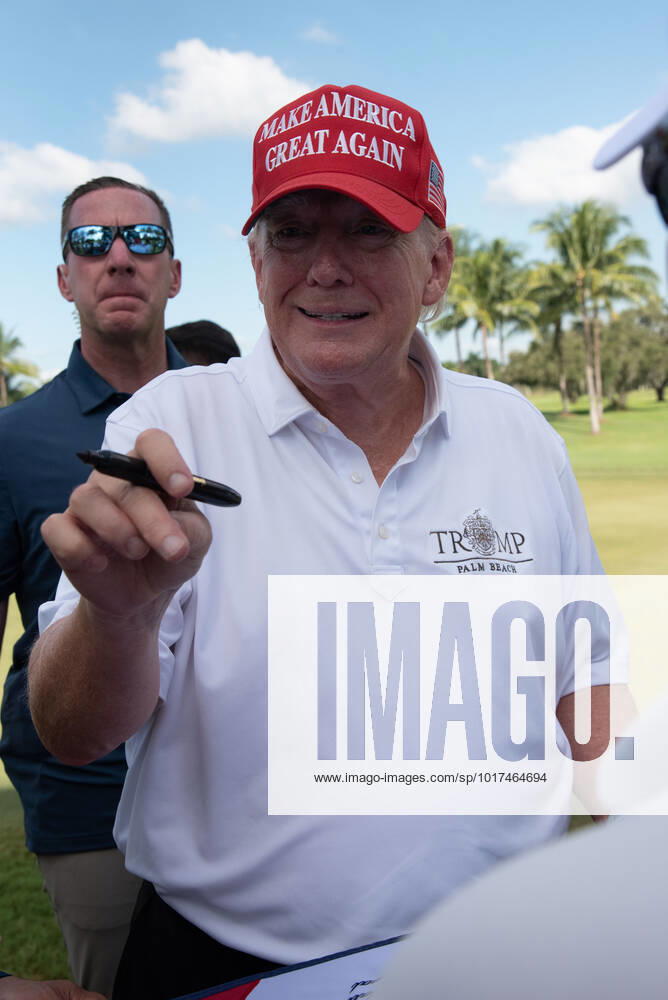 DORAL, FL - OCTOBER 27: Former President Donald Trump, signs autographs during the ProAm ahead of the LIV Golf Team Championship, on October. 27, 2022, at Trump National Doral Golf Club in Doral, FL. (Photo by Michele Eve Sandberg Icon Sportswire) GOLF: OCT 27 LIV Golf Invitational Series Miami Icon221027012