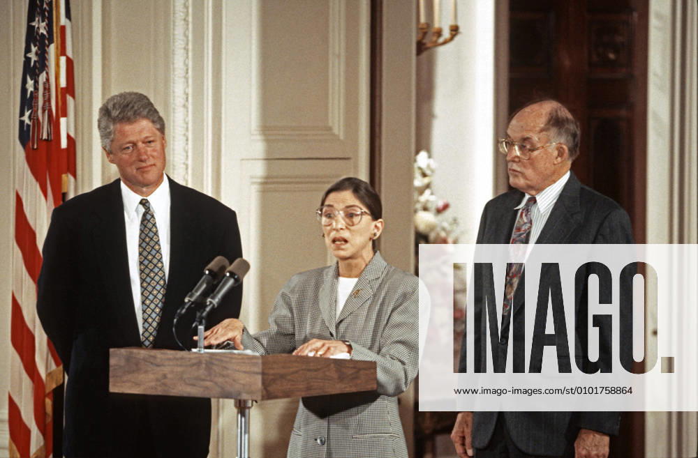IMAGO ICONS: Ruth Bader Ginsburg August 10, 1993, Washington, District of Columbia, USA: Associate Justice of the Supreme Court Ruth Bader Ginsburg, center, makes remarks prior to taking the oath of office during a swearing-in ceremony in the East Room of the White House in Washington, DC on August 10, 1993. Looking on are United States President Bill Clinton, left, and Chief Justice of the United States William H. Rehnquist, right. Justice Ginsburg replaces Associate Justice Byron R. White Washington USA - ZUMAs152 19930810_zaa_s152_010