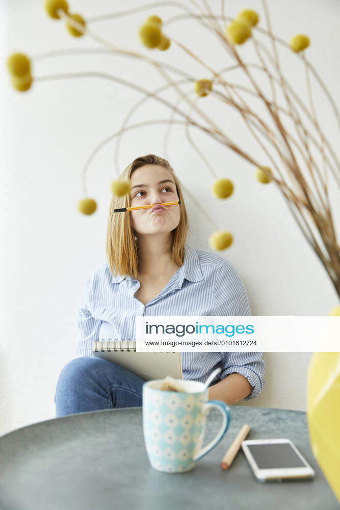 Portrait of young woman pulling funny face model released Symbolfoto property released FSF01085