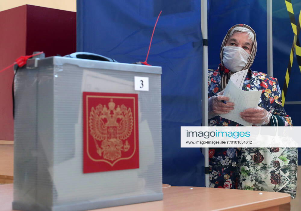 A woman emerges from a booth at polling station No 1331 to cast her vote in the 2020 Russian constitutional referendum. The referendum on proposed amendments to the Russian constitution is held from June 25 through July 1, 2020. Donat Sorokin TASS TS0DE1A6