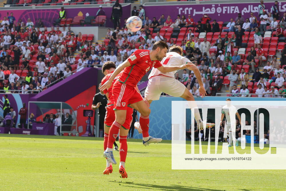 Wales v Iran 2022 FIFA World Cup, WM, Weltmeisterschaft, Fussball Ben Davies of Wales in an aerial challenge with Ali Gholizadeh of Iran during the 2022 FIFA World Cup Group B match at Ahmad Bin Ali Stadium, Al-Rayyan Content Not Available For UK Newspapers
