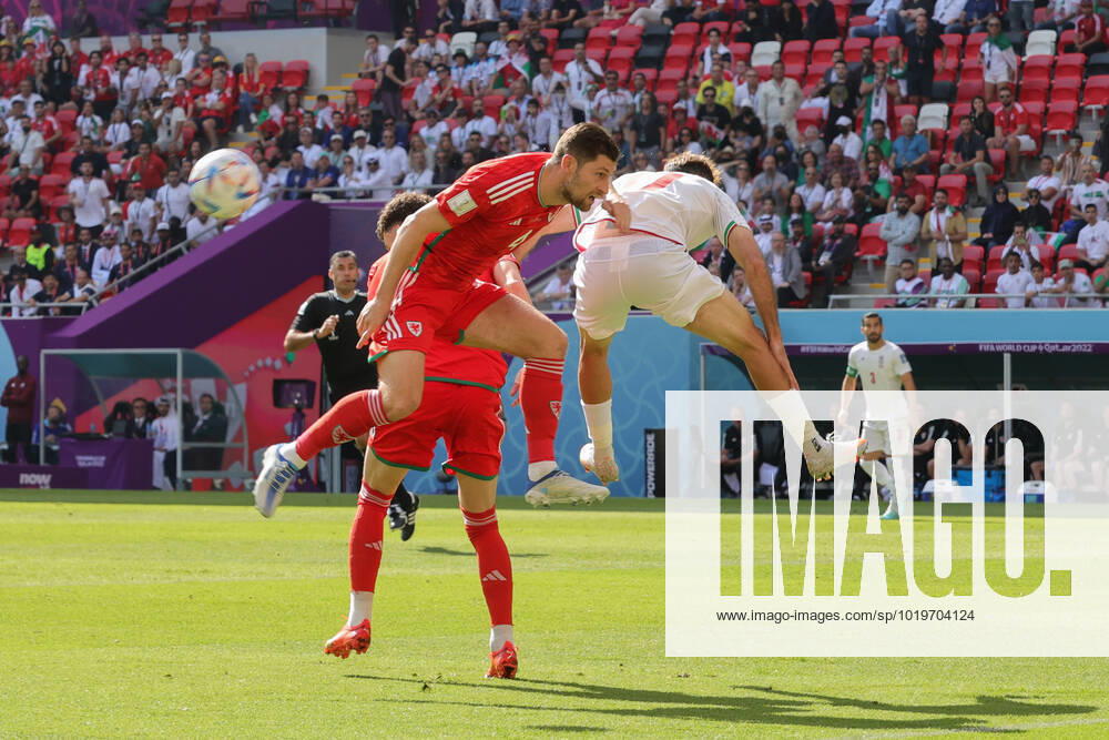 Wales v Iran 2022 FIFA World Cup, WM, Weltmeisterschaft, Fussball Ben Davies of Wales in an aerial challenge with Ali Gholizadeh of Iran during the 2022 FIFA World Cup Group B match at Ahmad Bin Ali Stadium, Al-Rayyan Content Not Available For UK Newspapers