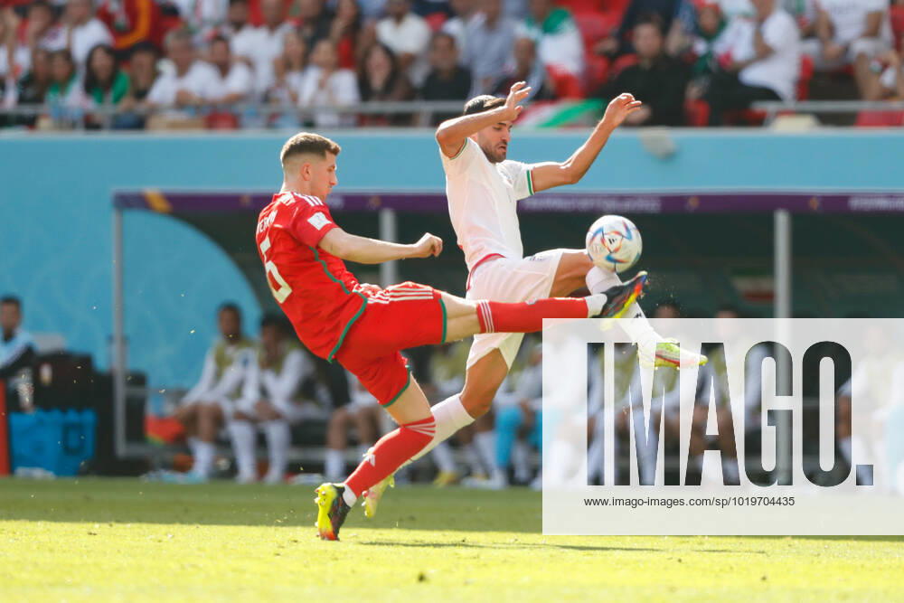 Wales v Iran 2022 FIFA World Cup, WM, Weltmeisterschaft, Fussball Joe Rodon of Wales clears from an Iranian player during the 2022 FIFA World Cup Group B match at Ahmad Bin Ali Stadium, Al-Rayyan Content Not Available For UK Newspapers