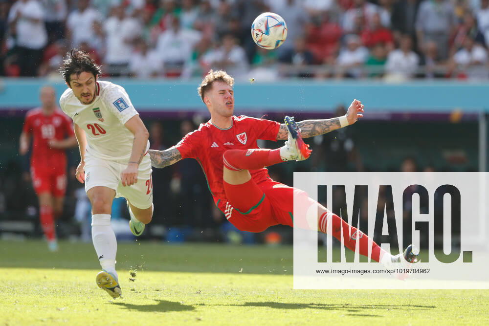 Wales v Iran 2022 FIFA World Cup, WM, Weltmeisterschaft, Fussball Joe Rodon of Wales clashes with Sardar Azmoun of Iran during the 2022 FIFA World Cup Group B match at Ahmad Bin Ali Stadium, Al-Rayyan Content Not Available For UK Newspapers