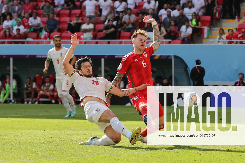 Wales v Iran 2022 FIFA World Cup, WM, Weltmeisterschaft, Fussball Sardar Azmoun of Iran and Joe Rodon of Wales clash during the 2022 FIFA World Cup Group B match at Ahmad Bin Ali Stadium, Al-Rayyan Content Not Available For UK Newspapers