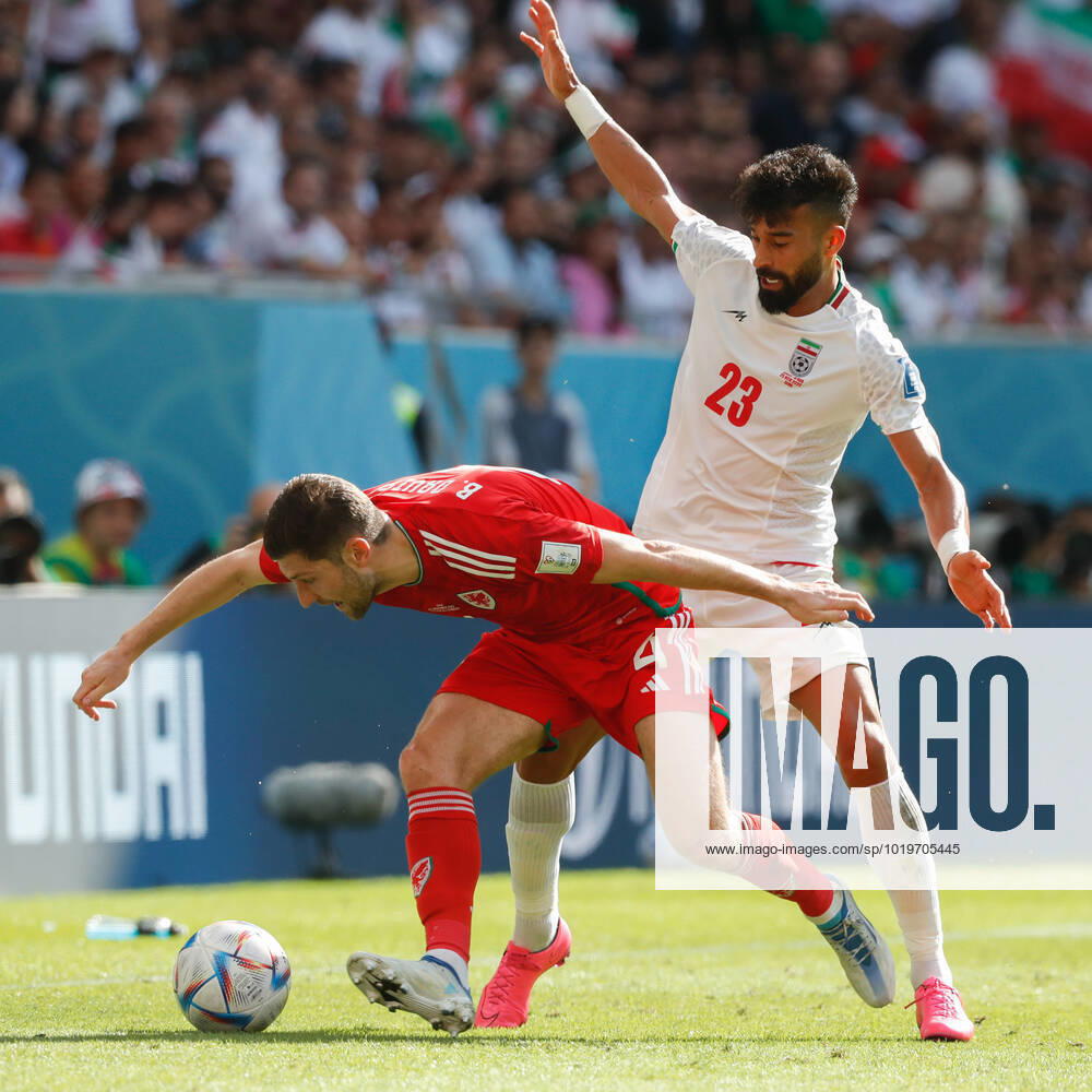 Wales v Iran 2022 FIFA World Cup, WM, Weltmeisterschaft, Fussball Ben Davies of Wales is challenged by Ramin Rezaeian of Iran during the 2022 FIFA World Cup Group B match at Ahmad Bin Ali Stadium, Al-Rayyan Content Not Available For UK Newspapers