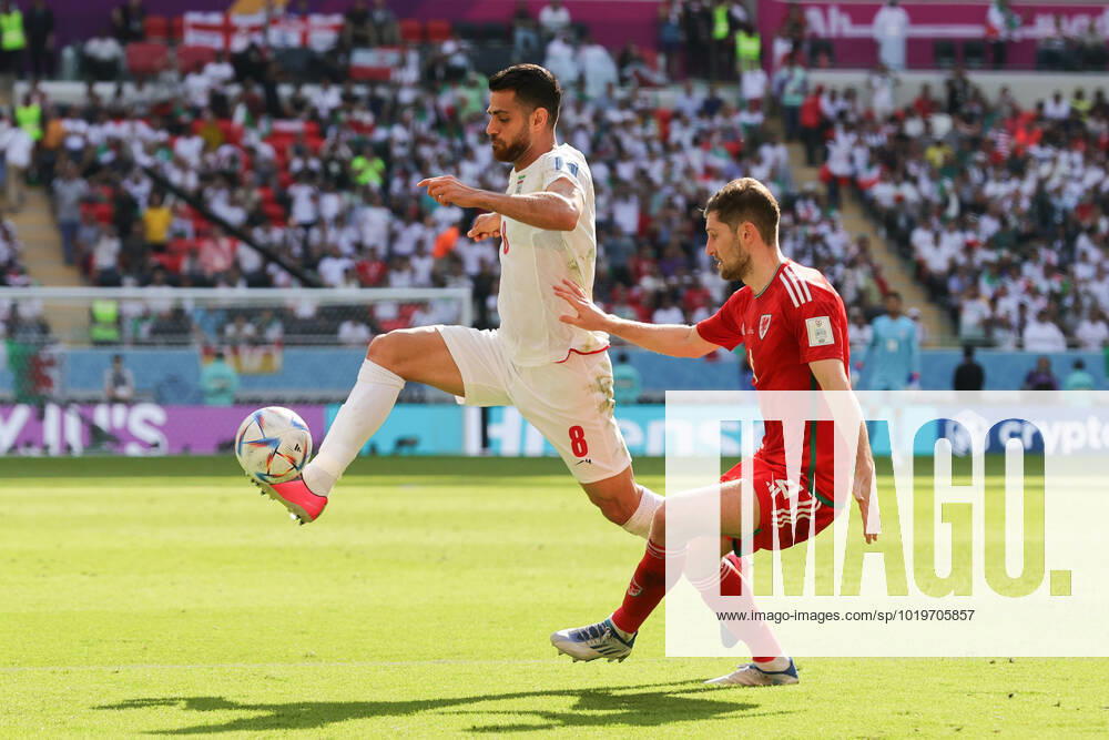 Wales v Iran 2022 FIFA World Cup, WM, Weltmeisterschaft, Fussball Morteza Pouraliganji of Iran controls the ball ahead of Ben Davies of Wales during the 2022 FIFA World Cup Group B match at Ahmad Bin Ali Stadium, Al-Rayyan Content Not Available For UK Newspapers