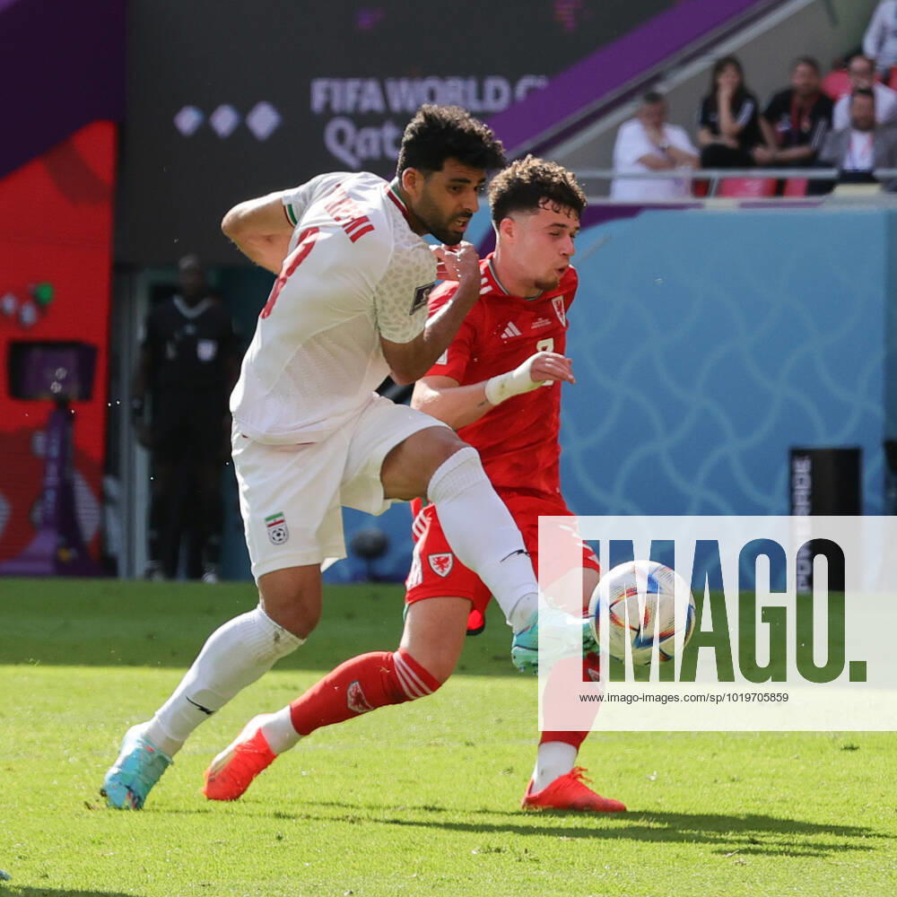 Wales v Iran 2022 FIFA World Cup, WM, Weltmeisterschaft, Fussball Mehdi Taremi of Iran clashes with Neco Williams of Wales during the 2022 FIFA World Cup Group B match at Ahmad Bin Ali Stadium, Al-Rayyan Content Not Available For UK Newspapers