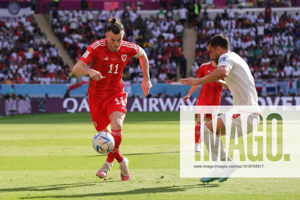 Wales v Iran 2022 FIFA World Cup, WM, Weltmeisterschaft, Fussball Gareth Bale of Wales takes on Ehsan Hajsafi of Iran during the 2022 FIFA World Cup Group B match at Ahmad Bin Ali Stadium, Al-Rayyan Content Not Available For UK Newspapers