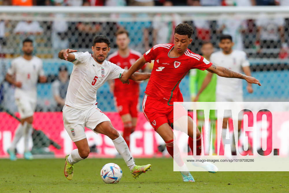 Wales v Iran 2022 FIFA World Cup, WM, Weltmeisterschaft, Fussball Brennan Johnson of Wales is challenged by Milad Mohammadi of Iran during the 2022 FIFA World Cup Group B match at Ahmad Bin Ali Stadium, Al-Rayyan Content Not Available For UK Newspapers