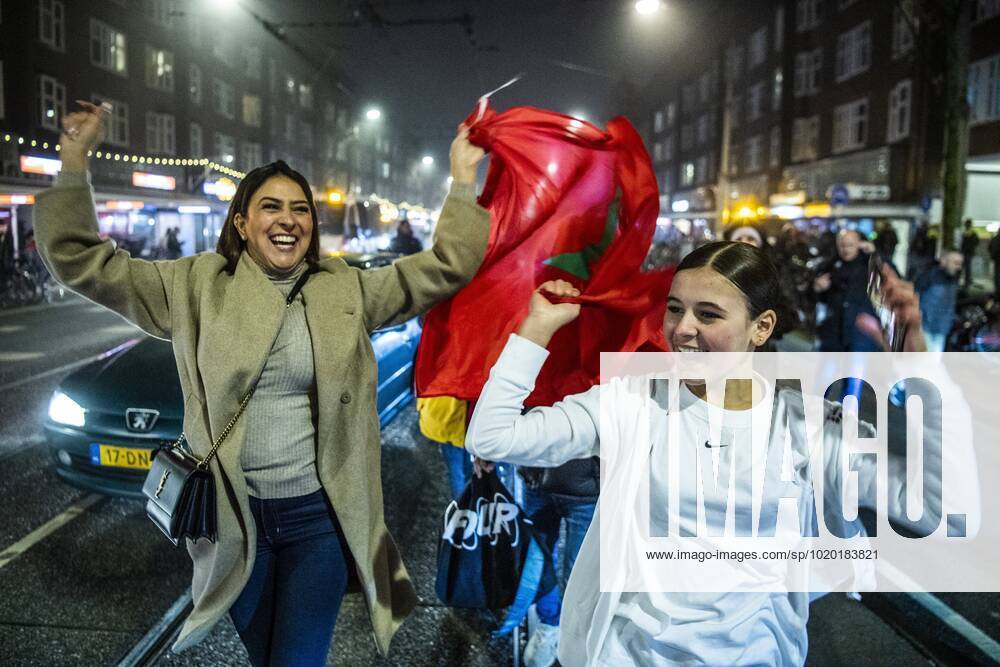 AMSTERDAM - Moroccan football supporters celebrate the 1-0 win of the Moroccan football team on the Mercatorplein in Amsterdam during the match between Morocco and Portugal at the World Cup in Qatar. ANP OLAF KRAAK ANPxSportx IVx