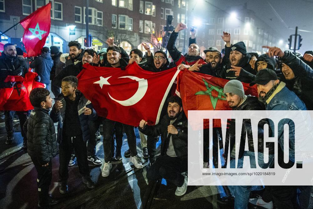 AMSTERDAM - Moroccan football supporters celebrate the 1-0 win of the Moroccan football team on the Mercatorplein in Amsterdam during the match between Morocco and Portugal at the World Cup in Qatar. ANP OLAF KRAAK ANPxSportx IVx