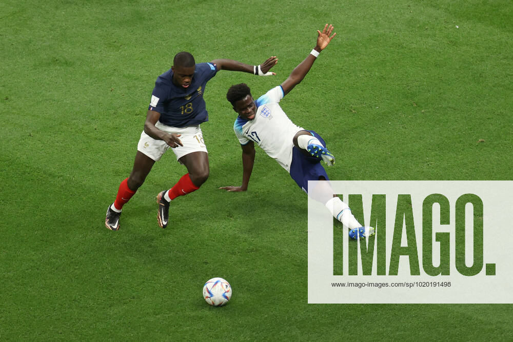 England v France : FIFA World Cup, WM, Weltmeisterschaft, Fussball 10 December 2022, Al Kohr - FIFA World Cup Qatar 2022 - Quarter-Finals - England v France - Dayot Upamecano of France and Bukayo Saka of England - Photo: Charlotte Wilson Offside. Al Kohr Qatar