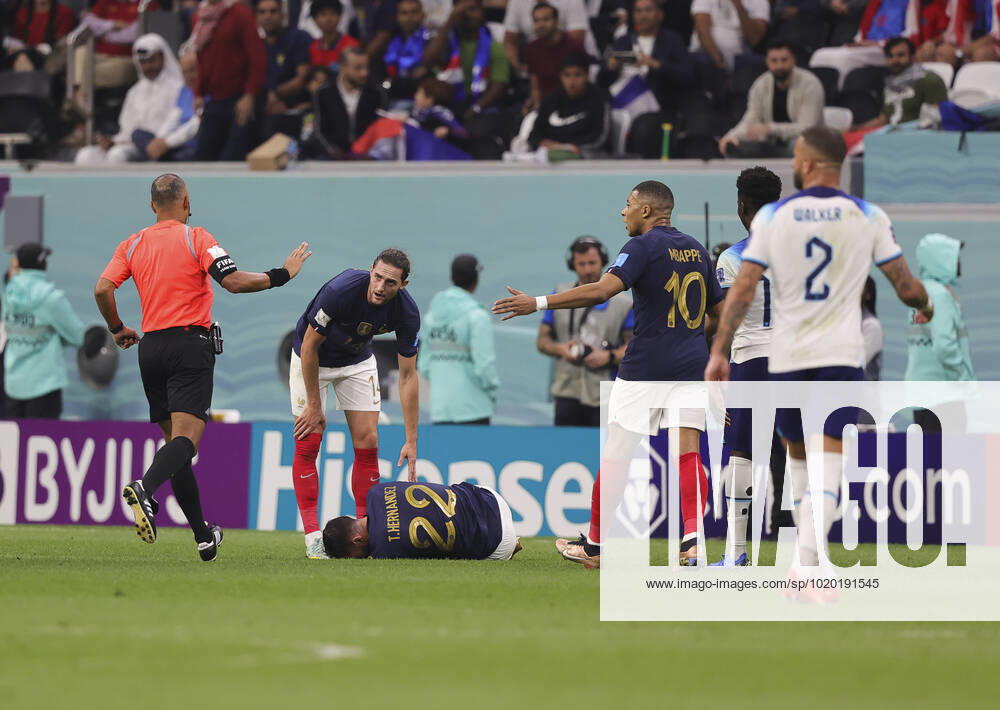 England v France 2022 FIFA World Cup, WM, Weltmeisterschaft, Fussball Theo Hernandez of France on the floor with an injury during the 2022 FIFA World Cup Quarter-final match at Al Bayt Stadium, Al Bayt Content Not Available For UK Newspapers