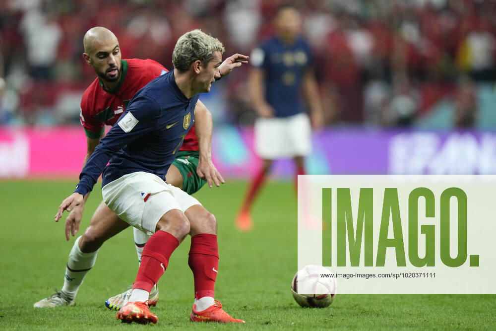 France v Morocco: Semi Final - FIFA World Cup, WM, Weltmeisterschaft, Fussball Qatar 2022 Antoine Griezmann second striker of France and Atletico de Madrid and Sofyan Amrabat defensive midfield of Morocco and ACF Fiorentina compete for the ball during the FIFA World Cup Qatar 2022 semi final match between France and Morocco at Al Bayt Stadium on December 14, 2022 in Al Khor, Qatar. Al Khor Qatar